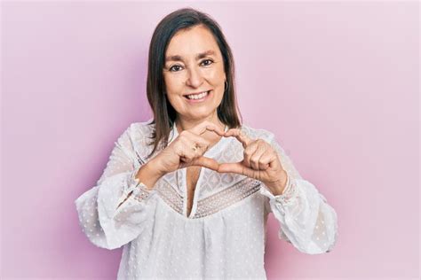 Middle Age Hispanic Woman Wearing Casual Clothes Smiling In Love Doing