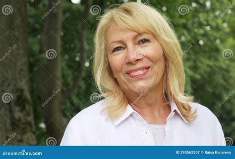 Beautiful Blonde Woman Of Sixty Years Old In A Summer Park Close Up