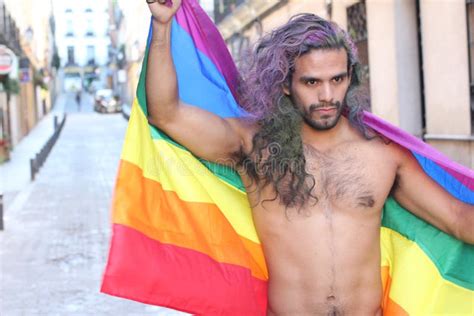 Determined Gay Man Marching With The Rainbow Flag Stock Photo Image Of Long Latino 138591238
