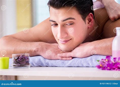 The Handsome Man In Spa Massage Concept Stock Photo Image Of Candle