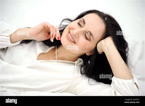 Pleasure Bliss Pleasant Emotions Beautiful Brunette Woman Lies On White Bed In Pajamas In