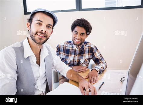 Smiling Gay Couple In Office Stock Photo Alamy