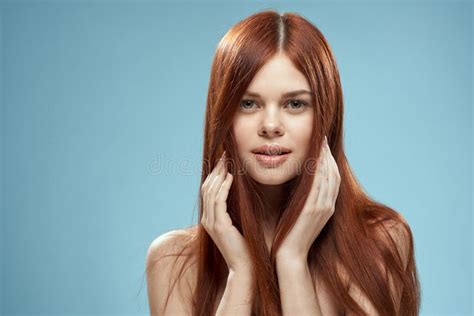 Pretty Woman Holding Hair In Hands Grooming Naked Shoulders Cropped View Blue Background Stock