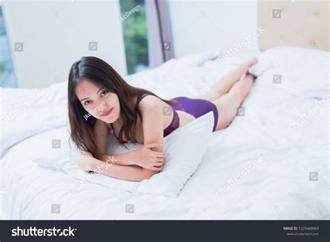 Sexy Asian Woman Purple Lingerie Lying Stock Photo