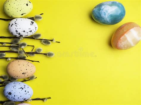 Pussy Willow Twigs With Easter Eggs Isolated On Yellow Spring And Easter Concept Stock Photo