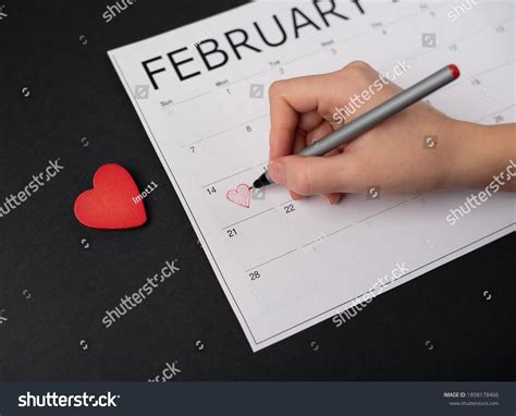 Womans Hand Holding Red Pen Above Stock Photo 1898178466 Shutterstock