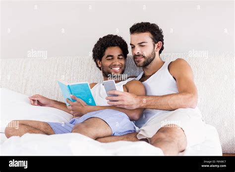Happy Gay Couple On Bed Together Stock Photo Alamy