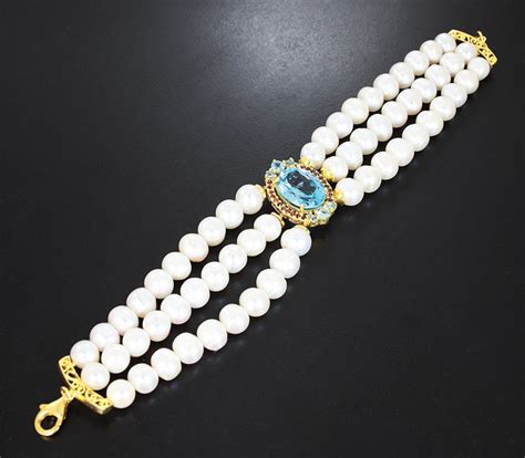 Широкий серебряный браслет с голубыми топазами, жемчугом и альмандинами ...