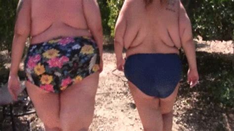 BBW Lola Love Bug And SSBBW Monika Mynx Are Walking Outdoors Topless In The Orchards And Lola