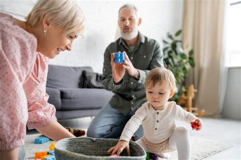 Mature Couple Playing Granddaughter Near Stock Photos Free Royalty Free Stock Photos From