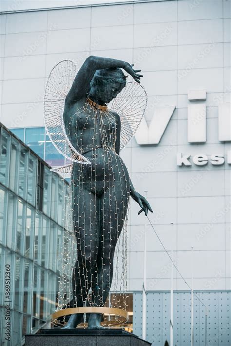 Tallinn Estonia Statue Of A Nude Woman With Her Hand On Her Head And Viru Trade Center