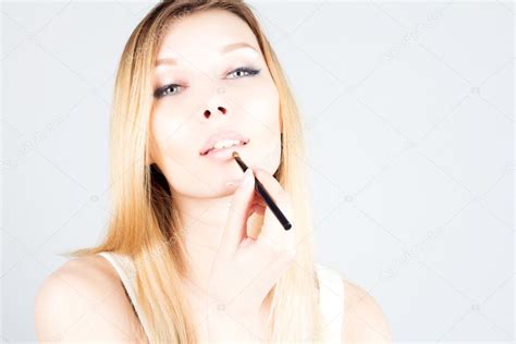 Sexy Blonde Woman Applying Lipstick On Lips Make Up Artist Stock Photo By FlashRomance 110523944