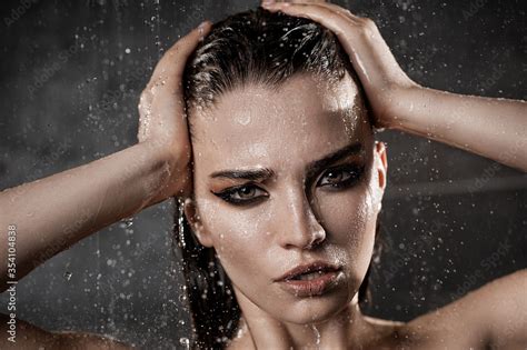 Wet Beautiful Brunette In The Shower With A Naked Bust Stock Photo Adobe Stock