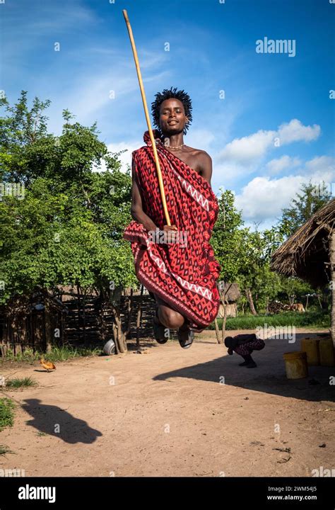young maasai warrior performs  traditional jumping dance