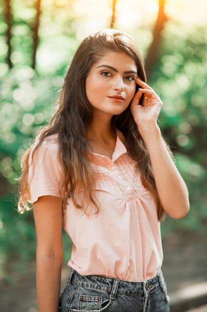 Premium Photo Beautiful Brunette Is Posing Outdoor On Summer Nature She Has Big Brown