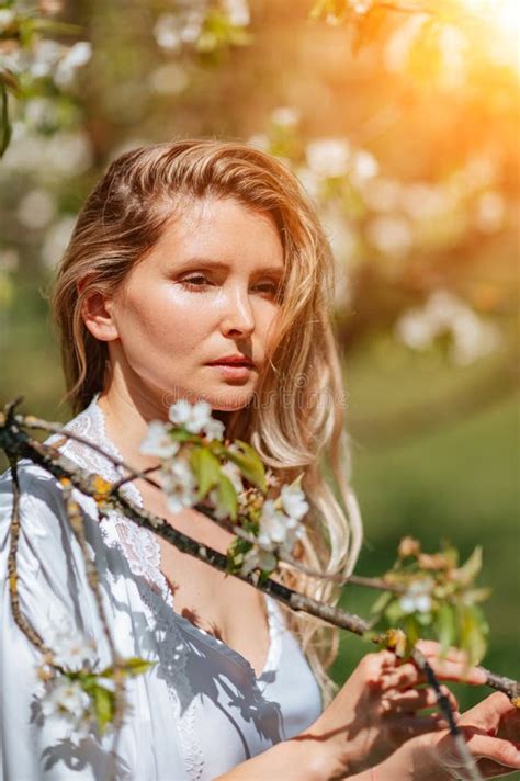 Blond Garden Portrait Of A Blonde In The Park Happy Woman With Long Blond Hair In A Blue Dress