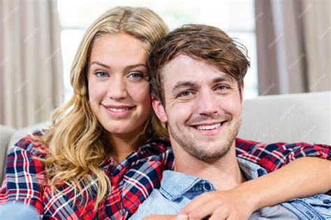 Premium Photo Cute Couple Cuddling On The Couch In The Living Room