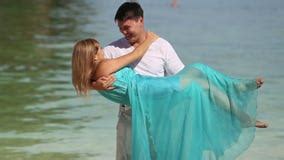 Strong Guy Presses To Breast Embraces And Lifts Blonde Girl Stock Footage Video Of Paradise
