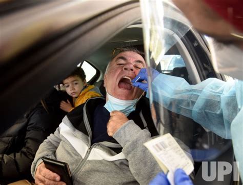 Photo A Medical Worker Administers A COVID 19 Test To An Israeli Man