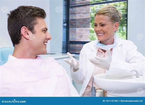 happy patient discussing  dentist stock photo image  lifestyles