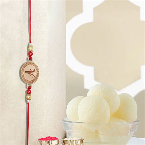 Order Sneh Personalised Small Oval Shaped Rakhi N Rasgulla Online
