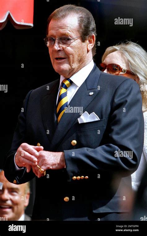 roger moore receives  star   hollywood walk  fame stephanie