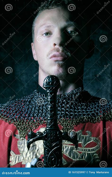 Portrait Of Handsome Medieval Knight In Suit Of Armour With Beard