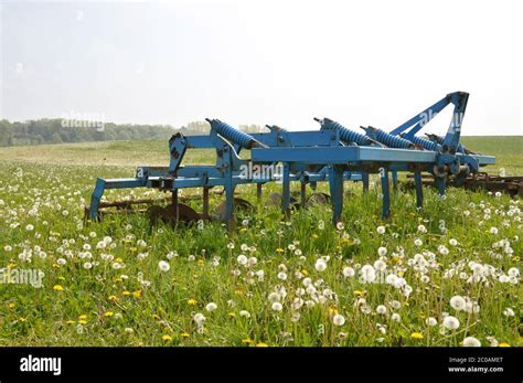 agricultural plow   green field   countryside stock photo alamy