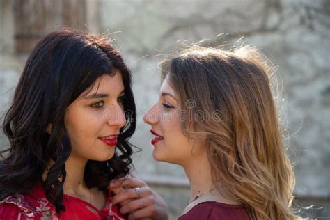 Close Up Of Two Girls Resting On Their Back Accomplices Among Them One Blonde And The Other