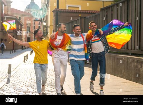 Couples Of Men Having Fun At The Demonstration With The Rainbow Flags Gay Pride Party In The