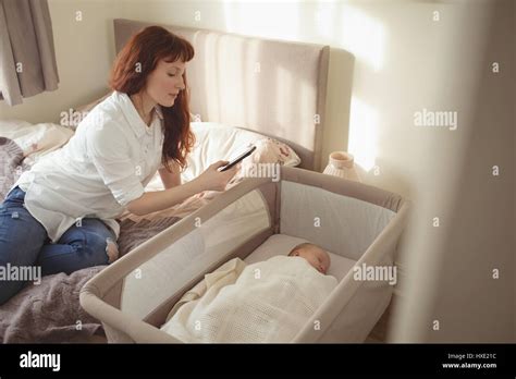 Mother Taking Picture Baby Sleeping Hi Res Stock Photography And Images