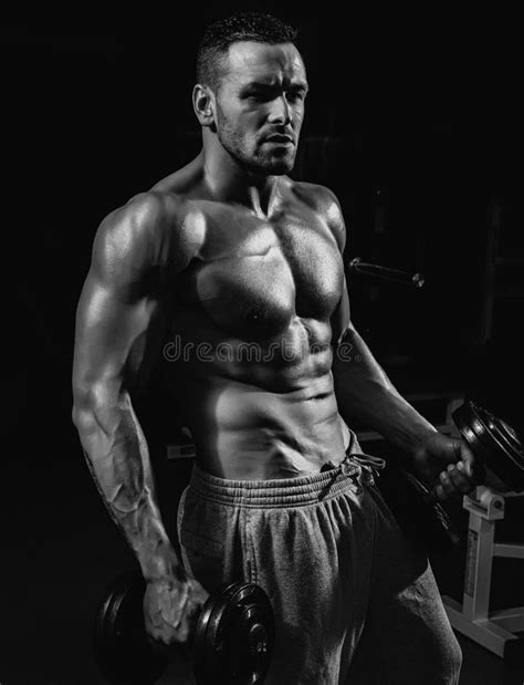 Dumbbells Sportsman In Gym Sporty Exercises Male Torso With Six Packs Man Naked Body Stock