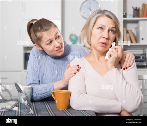 Adult Daughter Supporting Her Upset Mature Mother Stock Photo Alamy