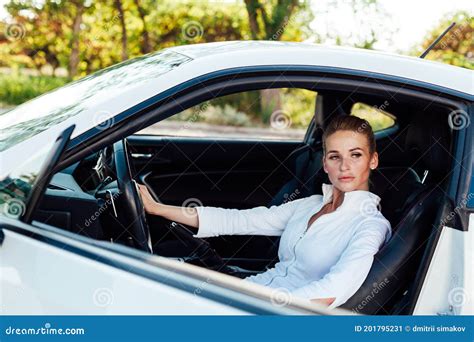 Beautiful Female Blonde Driver Behind The Wheel Of A White Car Stock Image Image Of Portrait