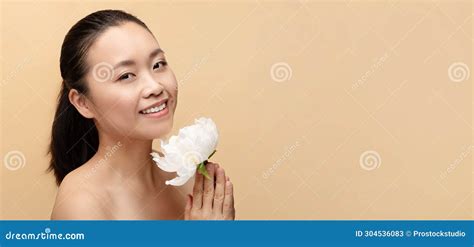 Cheerful Millennial Chinese Naked Woman With White Flower Enjoy Treatment Stock Image Image