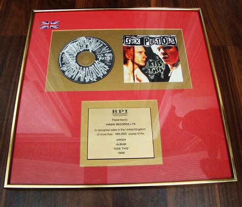 Sex Pistols Kiss This Gold 100 000 Sales Award Presented to Virgin Records Lts Officiële