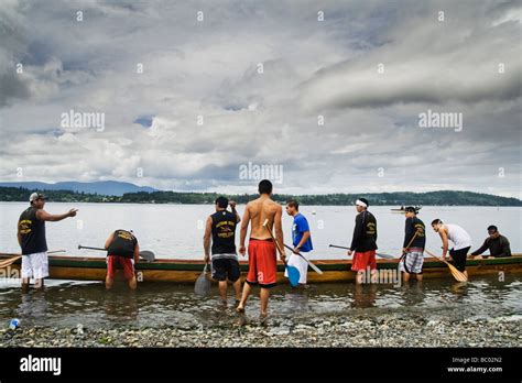 Young Men Prepare For A Canoe Race At The Lummi Indian Reservation