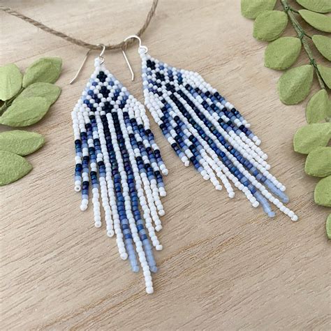 On A Backdrop Of Bright White These Fashion Bohemian Earrings Are Delicately Adorned With