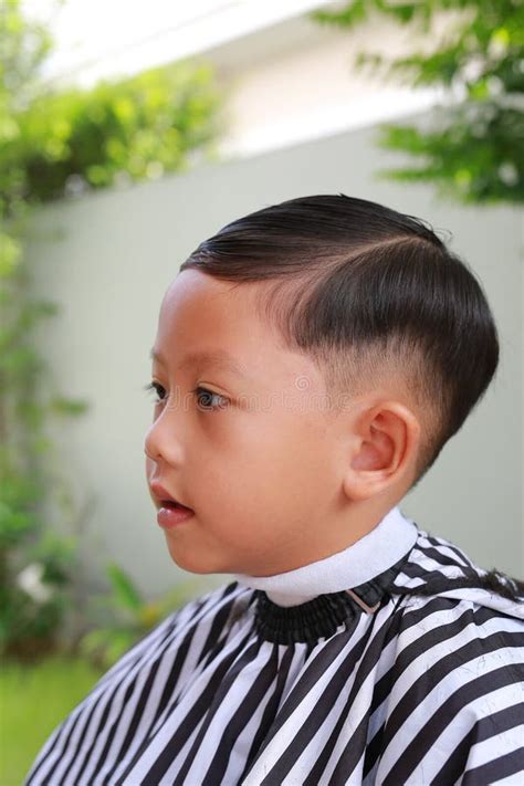 Portrait Of Asian Boy Cut In Haircut In The Garden Fashion Haircut For
