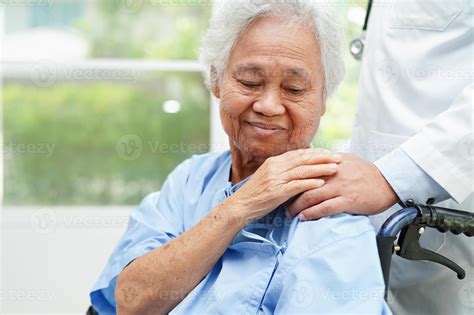 Asian doctor touching patient to support, consolation encourage and
