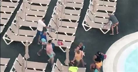 Tourists Wake Up Early To Take Their Favorite Beds By The Pool Video