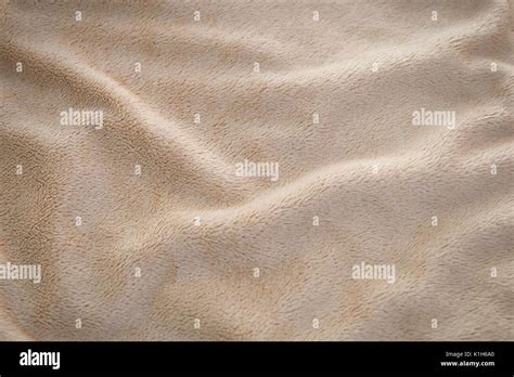 Fabric Texture Close Up Of Light Brown Cozy Blanket Fabric Texture