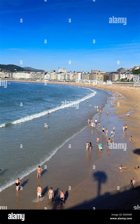 Summer Crowd Bathing And Walking On Concha Beach In San Sebastian