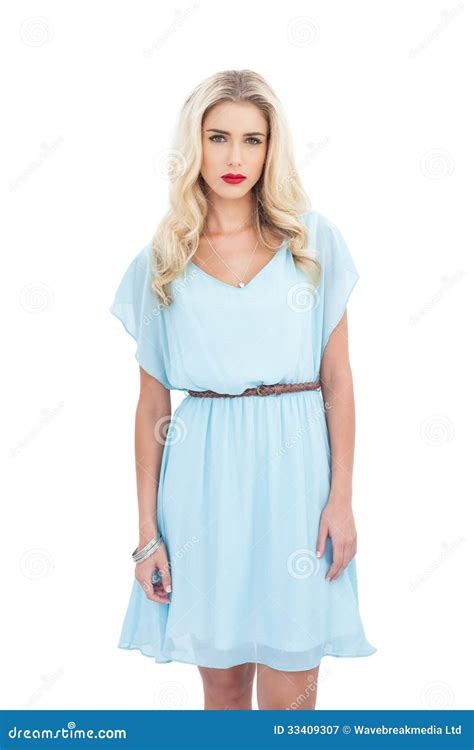 Charming Blonde Model In Blue Dress Looking At Camera Stock Image
