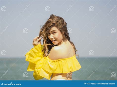 Portrait Asian Girl Long Hair Bikini Two Tone White And Yellow Standing Post Happy Posture By