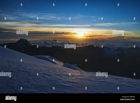 Scenic sunrise from mountain peak above clouds in Bolivian Andes Stock ...