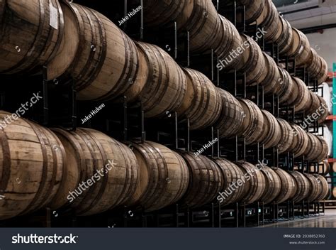 whiskey barrels aging distillery rack house stock photo