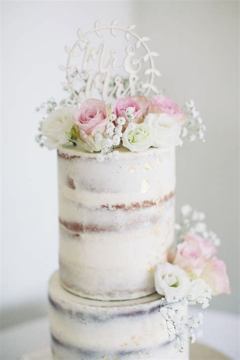 White Semi Naked Wedding Cake With Pink And White Roses White And