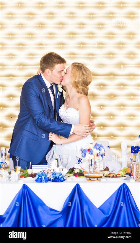 Handsome Brunette Groom Kissing Beautiful Bride In Wedding Dress Stock Photo Alamy