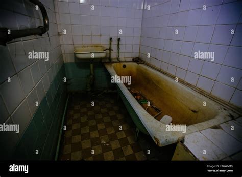 Creepy Bath Room In Abandoned Hospital Red Illuminated Horror Concept